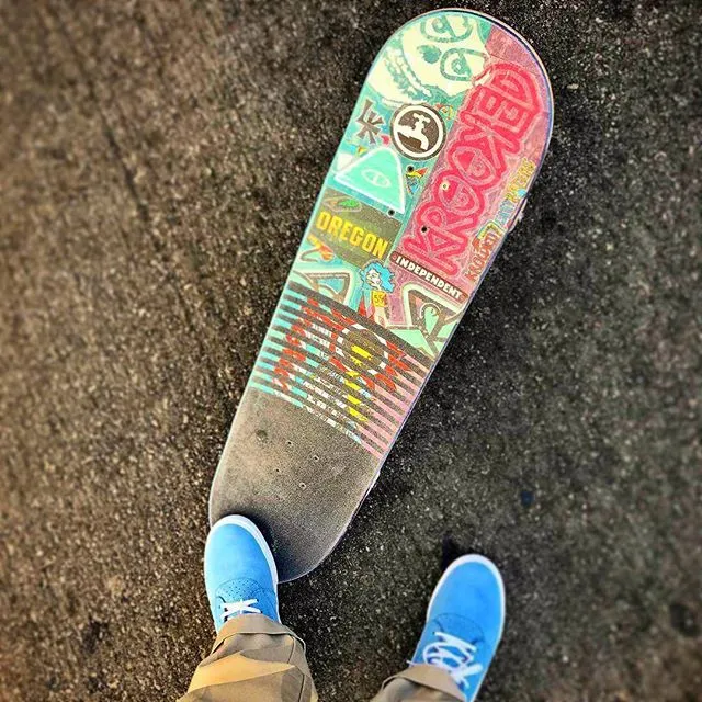 A skateboard with colourful grip tape
